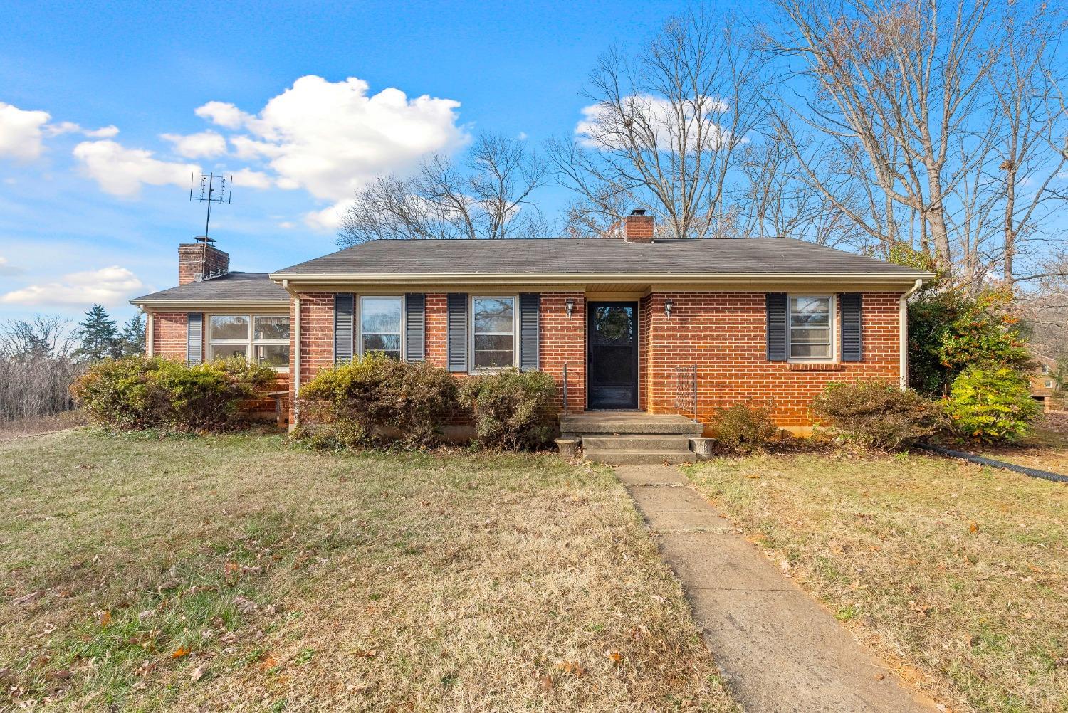 907 High Peak Road Monroe, VA 24574 - Photo 1 of 61 a front view of a house with a yard