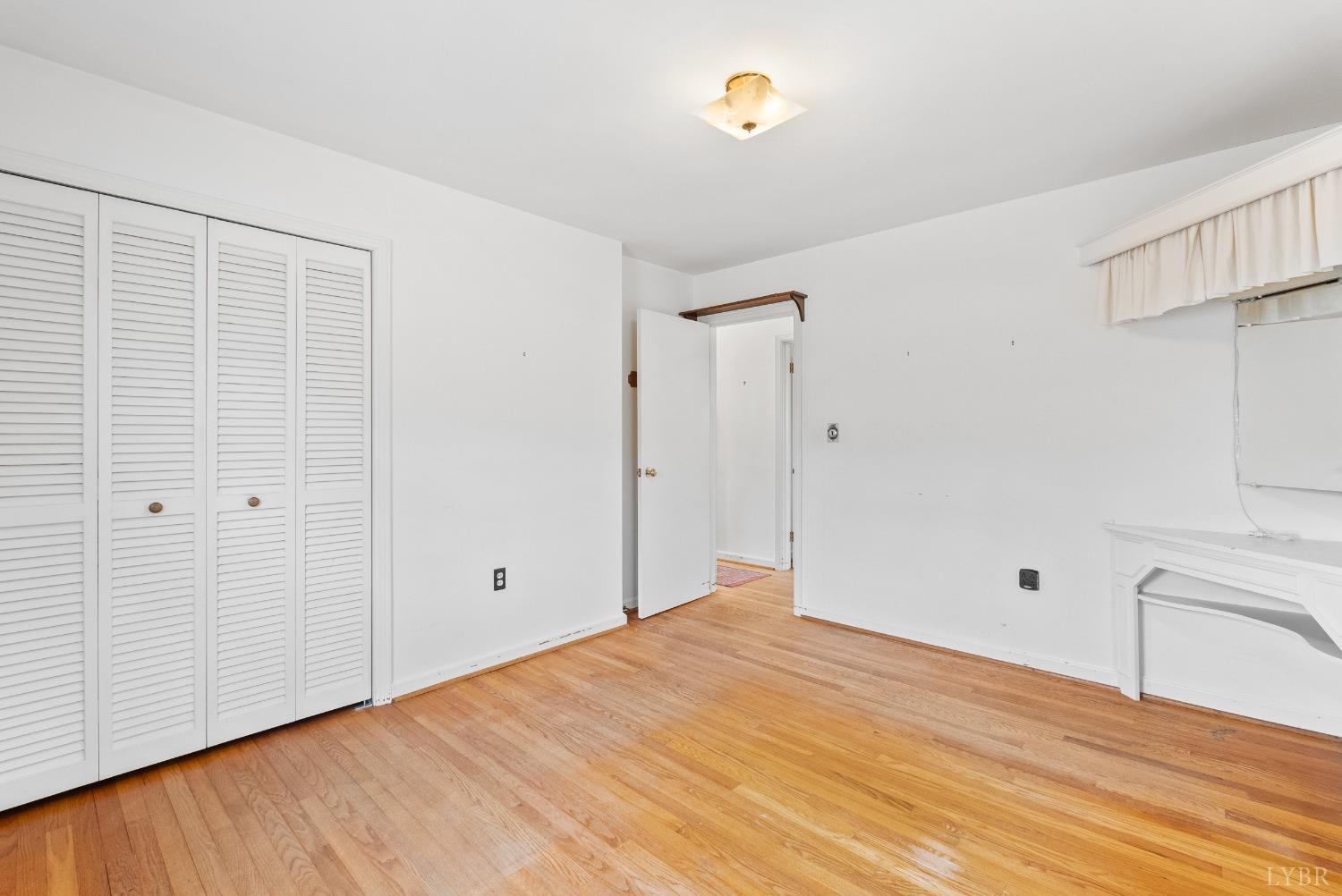 907 High Peak Road Monroe, VA 24574 - Photo 23 of 61 a view of empty room with wooden floor
