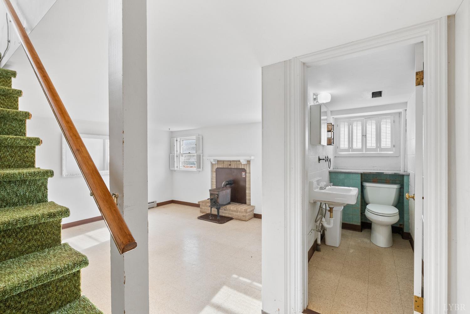907 High Peak Road Monroe, VA 24574 - Photo 24 of 61 a view of a hallway with wooden floor and staircase