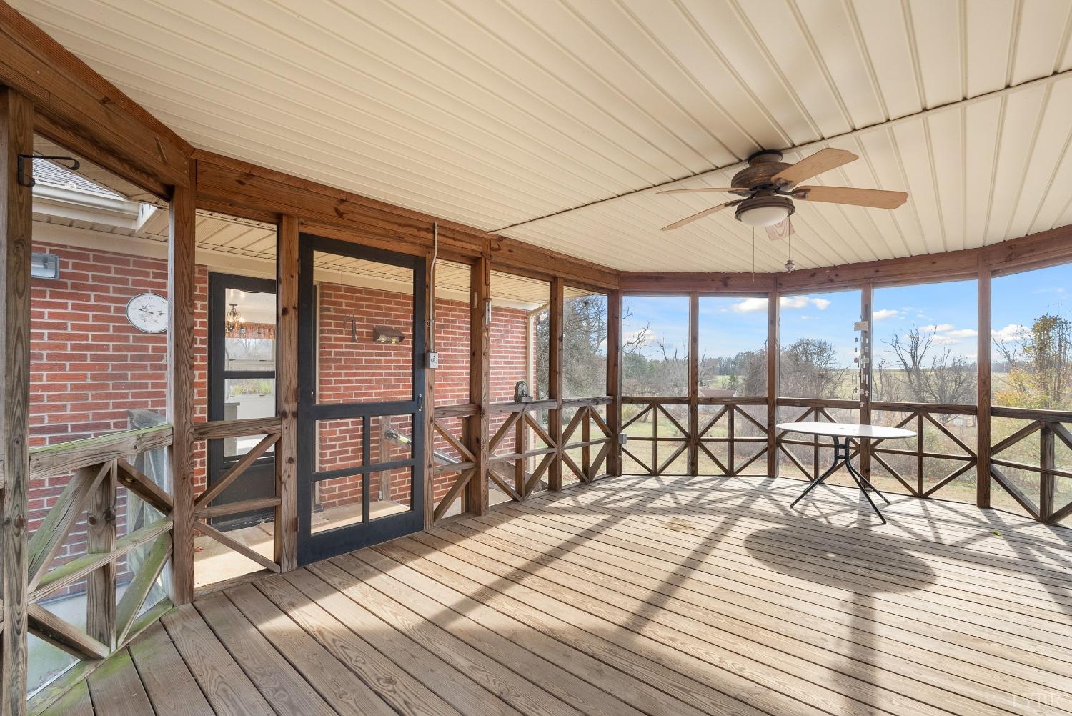 907 High Peak Road Monroe, VA 24574 - Photo 36 of 61 a view of a balcony with furniture and wooden floor