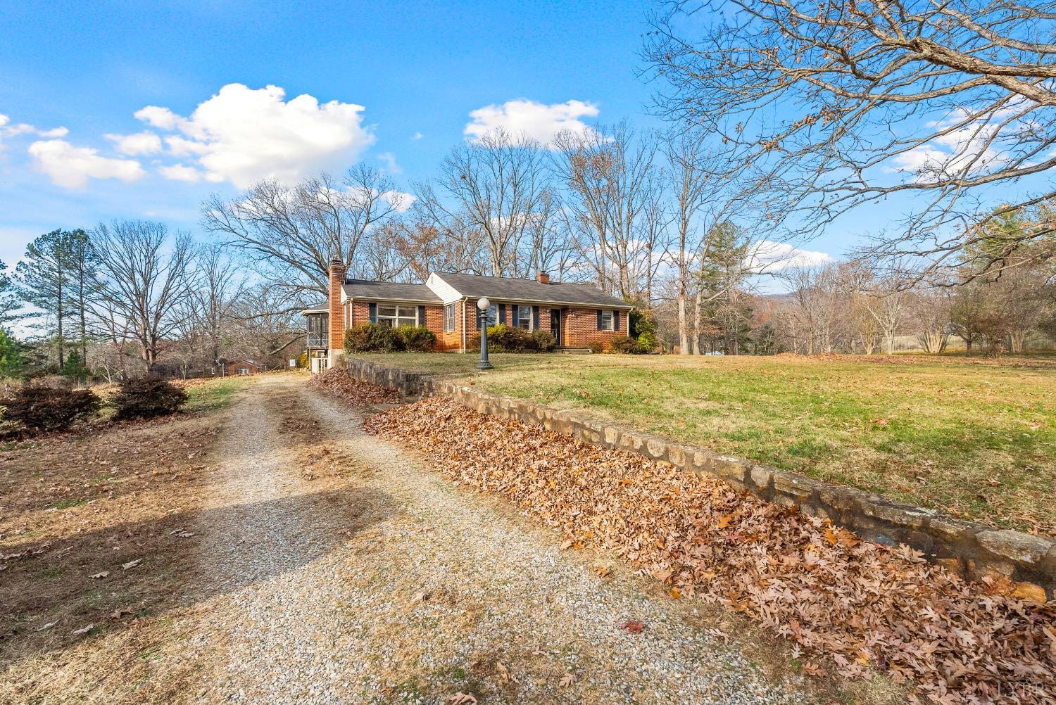 907 High Peak Road Monroe, VA 24574 - Photo 54 of 61 a view of a yard with a house in the background