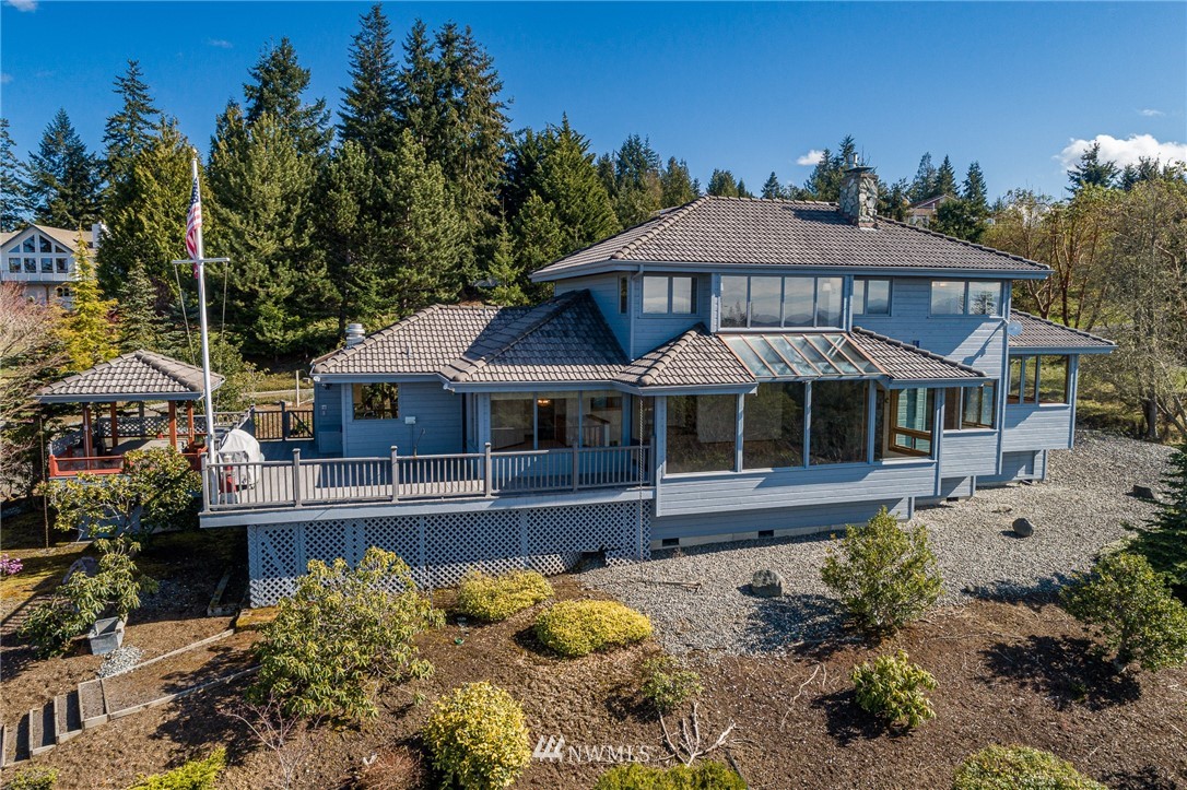 543 Ravens Ridge Road Sequim, WA 98382 - Photo 1 of 40 a front view of a house with a yard