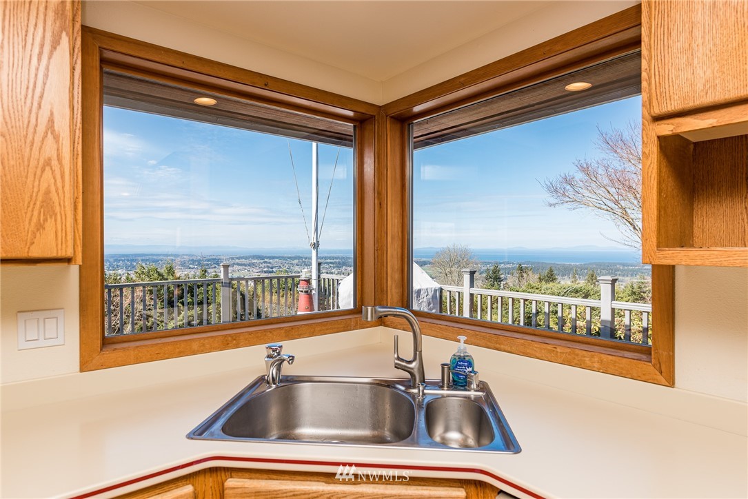 543 Ravens Ridge Road Sequim, WA 98382 - Photo 13 of 40 a sink and glass window