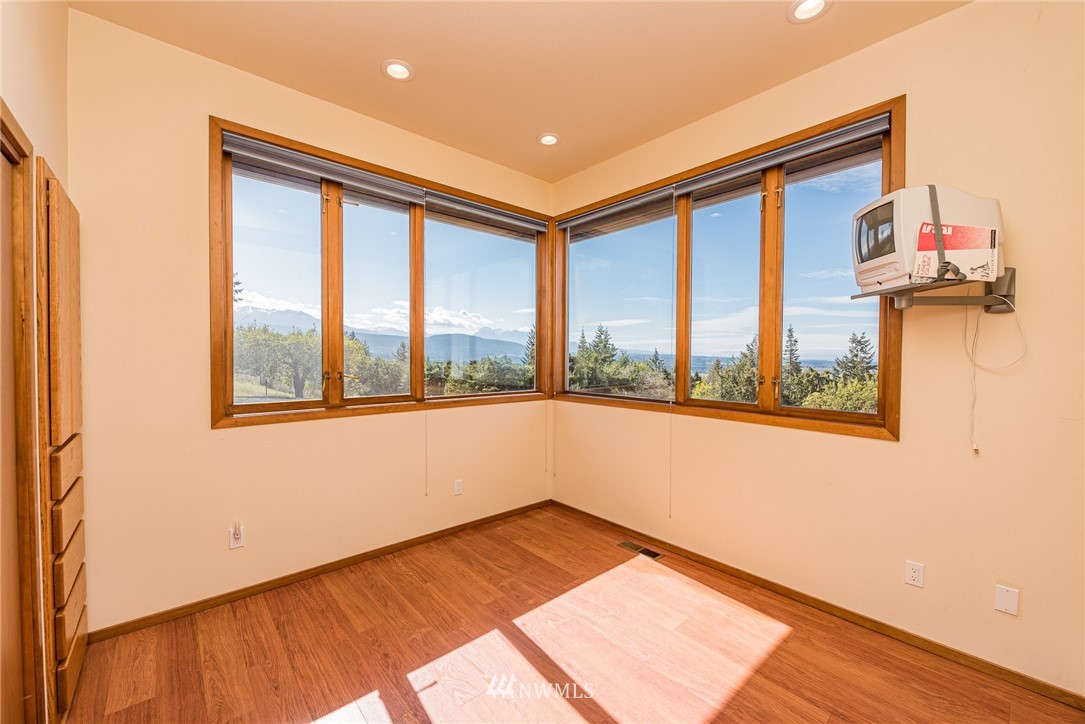 543 Ravens Ridge Road Sequim, WA 98382 - Photo 21 of 40 a view of an empty room with a window
