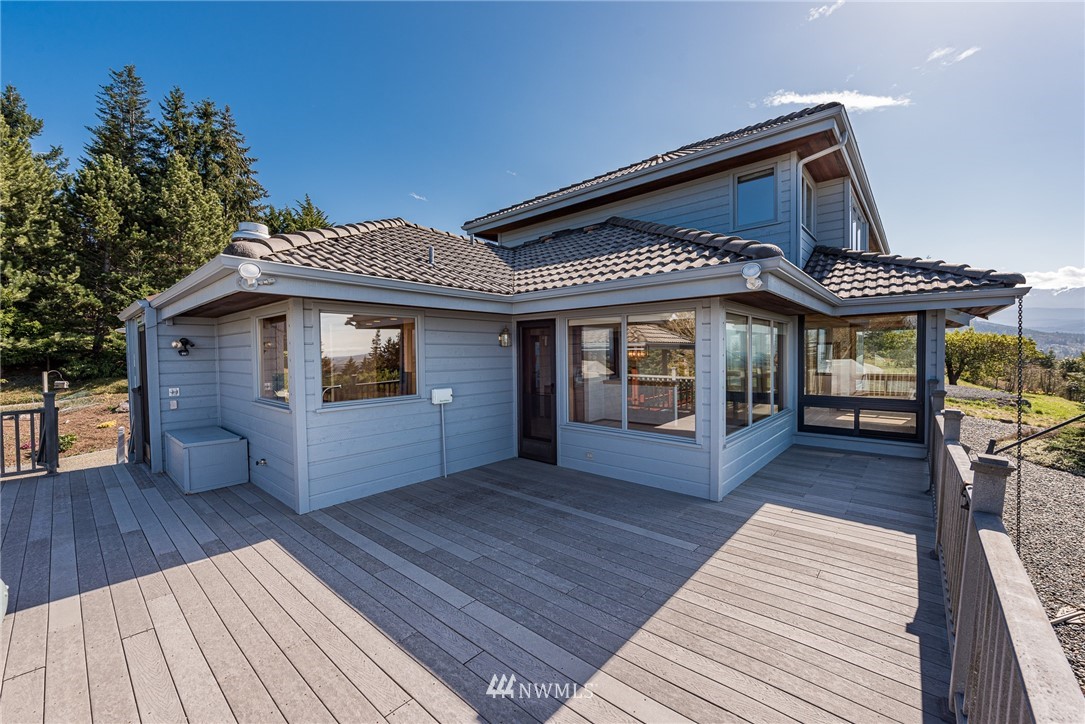 543 Ravens Ridge Road Sequim, WA 98382 - Photo 26 of 40 a front view of a house with a porch