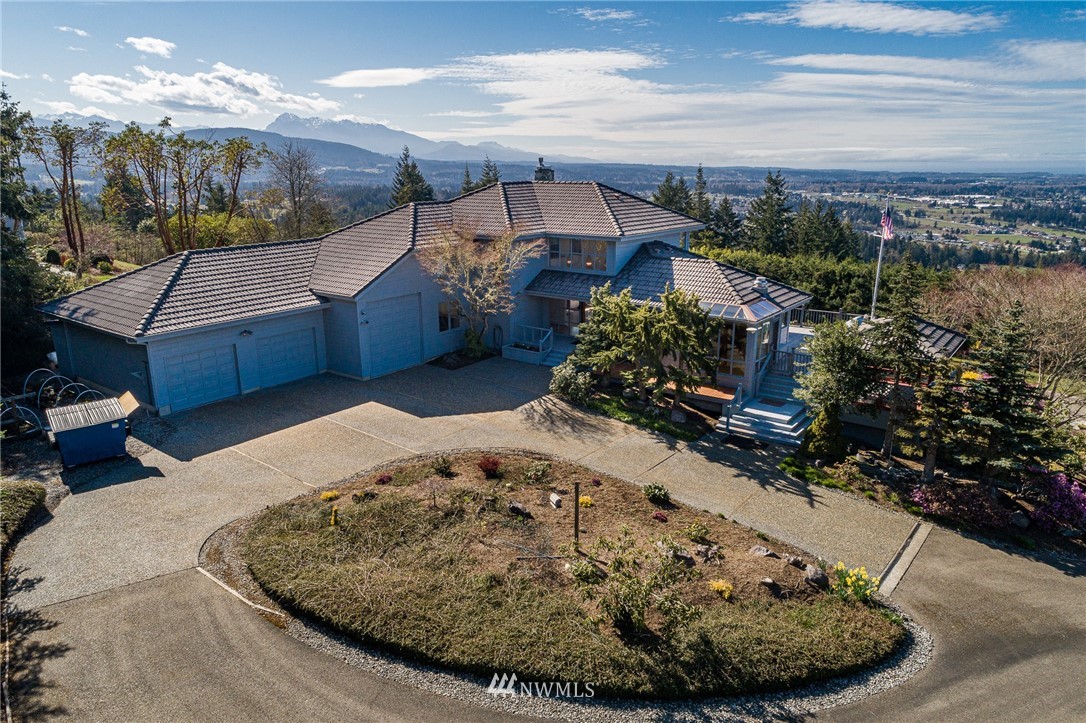 543 Ravens Ridge Road Sequim, WA 98382 - Photo 40 of 40 a view of a house with a yard porch and sitting area