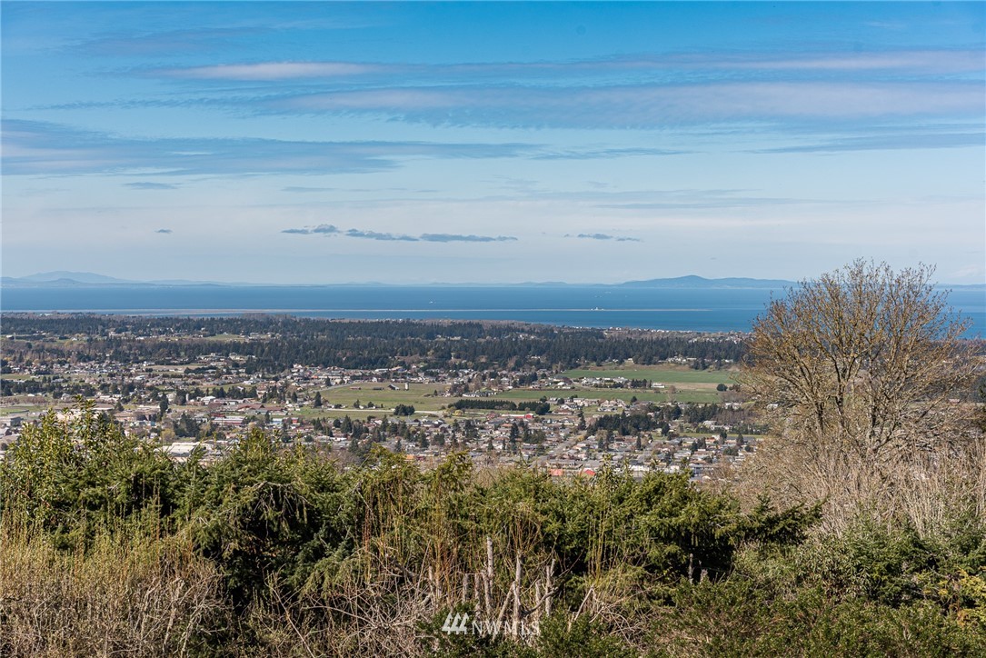 543 Ravens Ridge Road Sequim, WA 98382 - Photo 5 of 40 a view of a large building with a mountain in the background