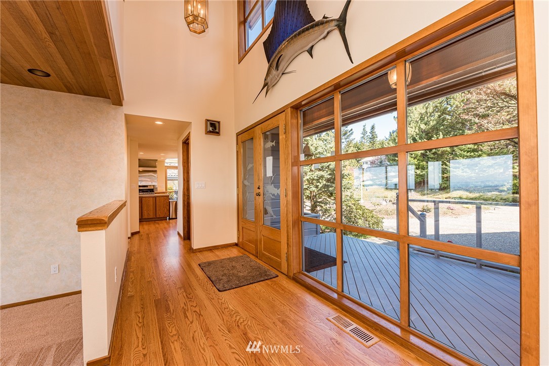 543 Ravens Ridge Road Sequim, WA 98382 - Photo 7 of 40 a area with wooden floor and furniture