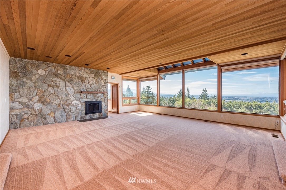 543 Ravens Ridge Road Sequim, WA 98382 - Photo 9 of 40 a view of an empty room with a fireplace
