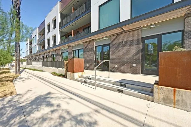 a view of a brick house with a large window