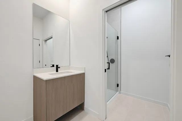 a bathroom with a toilet a sink and shower