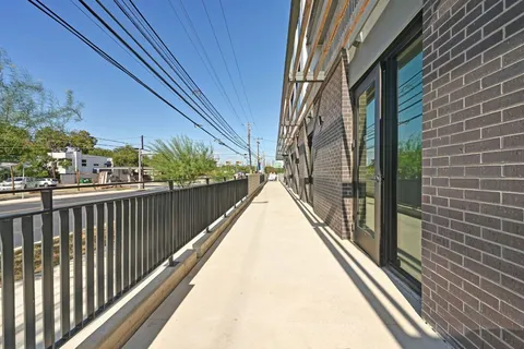 a kitchen with stainless steel appliances a refrigerator and a stove top oven