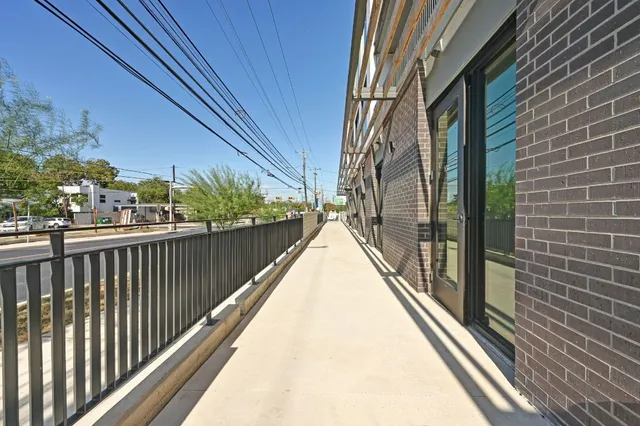 a kitchen with stainless steel appliances a refrigerator and a stove top oven