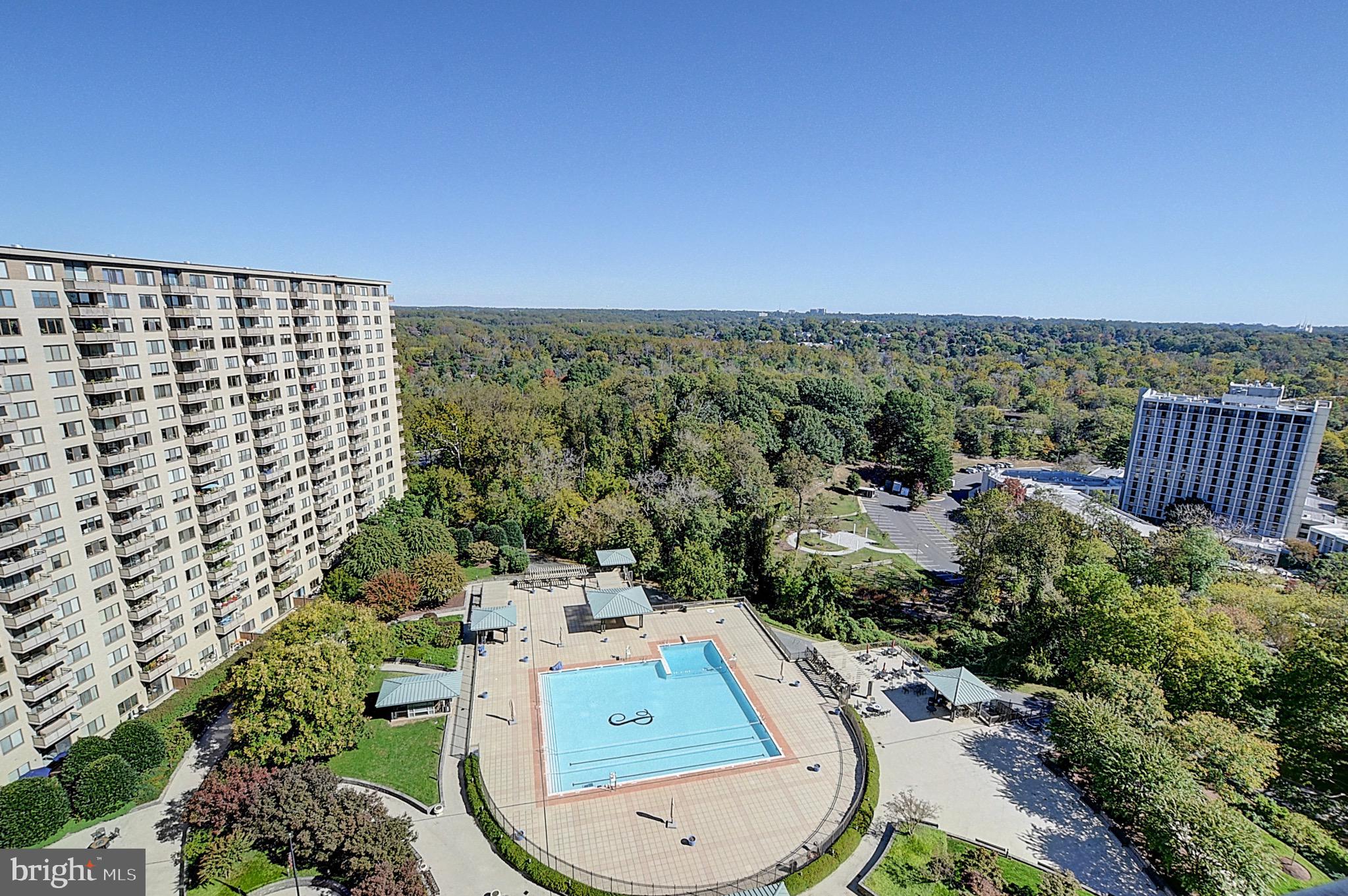 5225 Pooks Hill Road, Unit 1717S Bethesda, MD 20814 - Photo 11 of 12 aerial view of a residential apartment building with a yard
