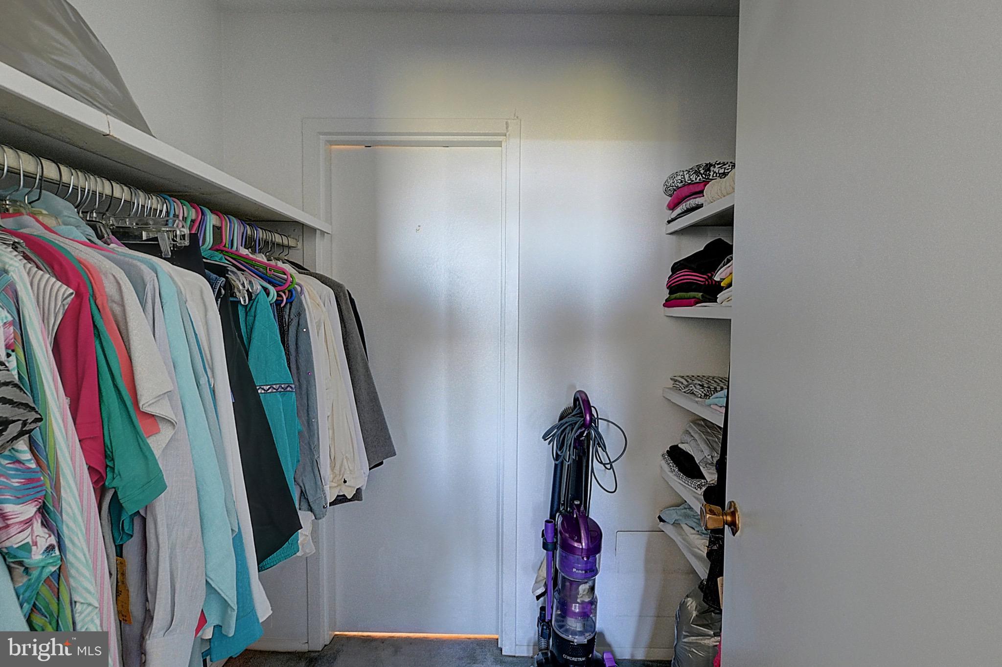 5225 Pooks Hill Road, Unit 1717S Bethesda, MD 20814 - Photo 4 of 12 a view of walk in closet with clothes and shoes