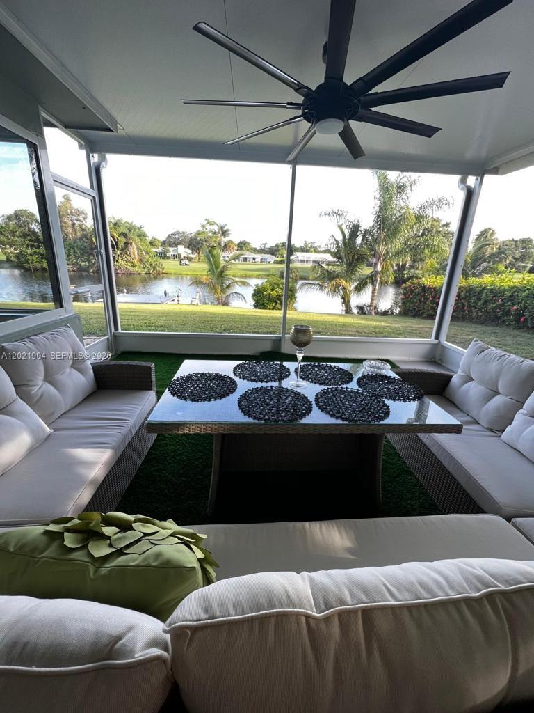 3324 Lakeview Boulevard Delray Beach, FL 33445 - Photo 26 of 36 a living room with furniture and a large window