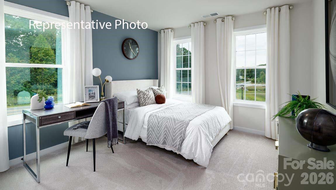 3117 Spring Iris Drive Denver, NC 28037 - Photo 17 of 42 a bed room with a bed and a window