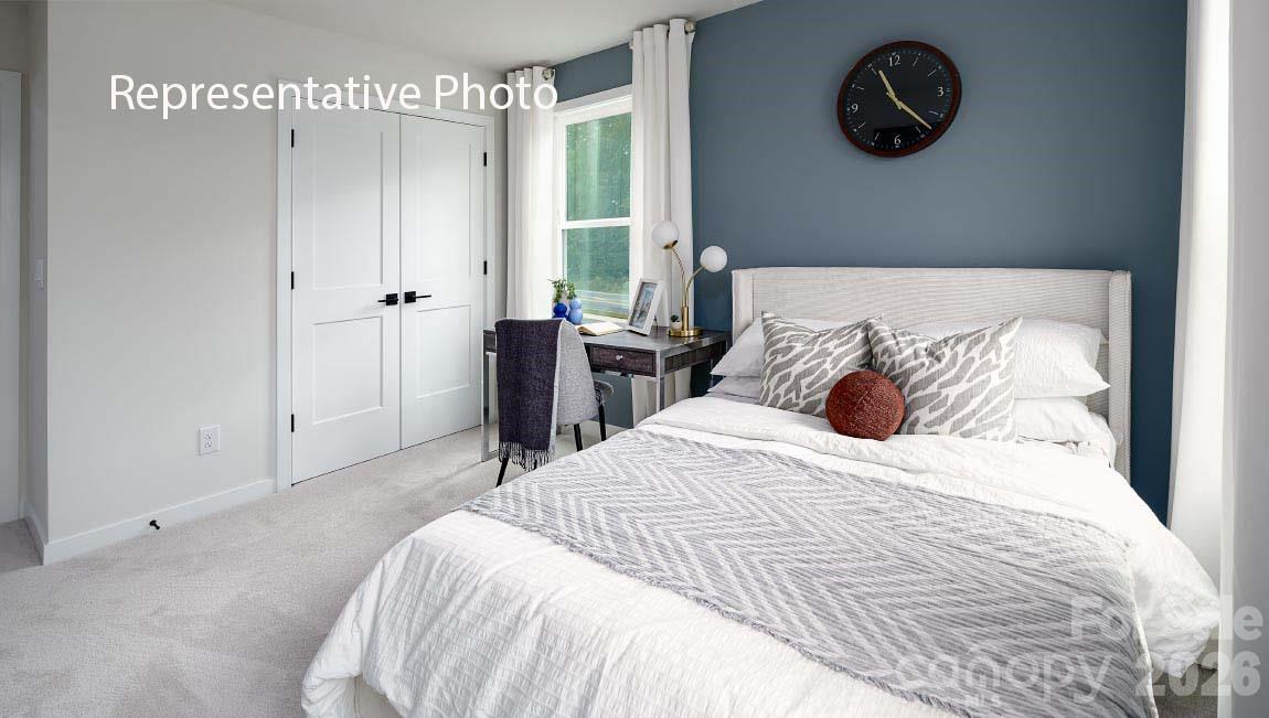 3117 Spring Iris Drive Denver, NC 28037 - Photo 18 of 42 a bed room with a bed and a painting on the wall