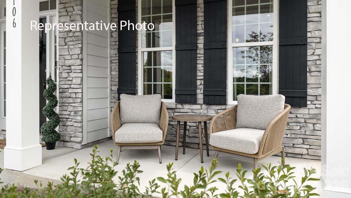 3117 Spring Iris Drive Denver, NC 28037 - Photo 2 of 42 a living room with furniture and a potted plant