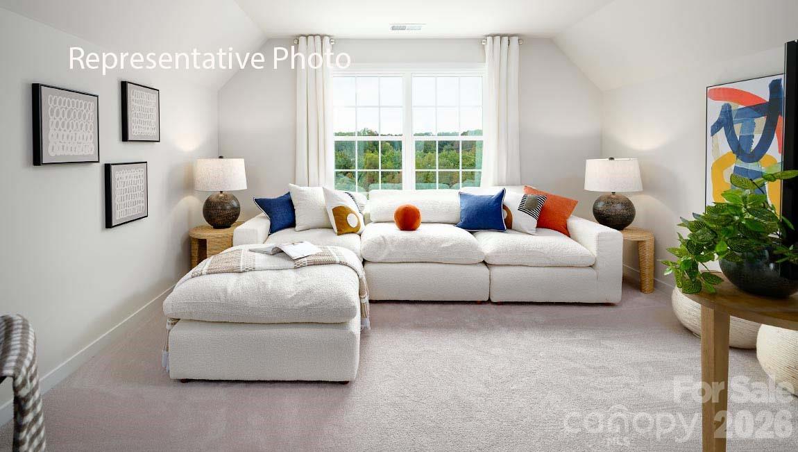 3117 Spring Iris Drive Denver, NC 28037 - Photo 23 of 42 a living room with furniture and a large window