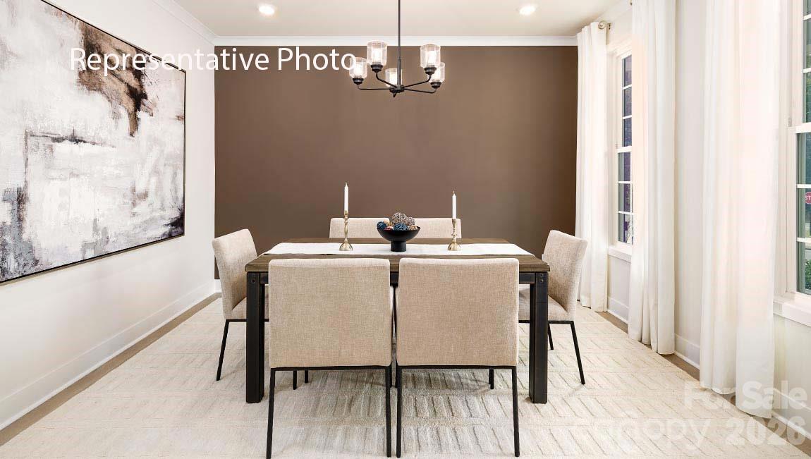 3117 Spring Iris Drive Denver, NC 28037 - Photo 28 of 42 a dining room with furniture and window