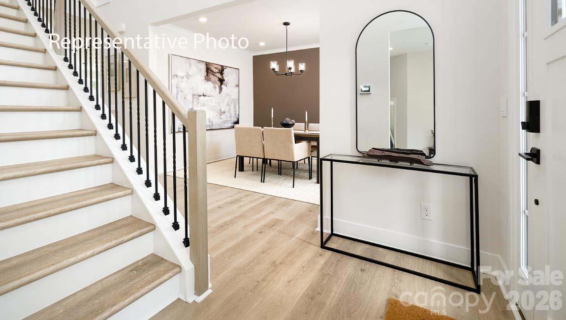 3117 Spring Iris Drive Denver, NC 28037 - Photo 35 of 42 a view of a hallway with wooden floor and staircase