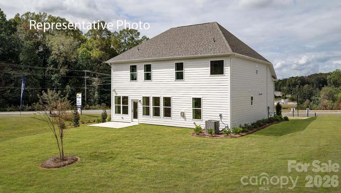 3117 Spring Iris Drive Denver, NC 28037 - Photo 5 of 42 a front view of a house with a yard