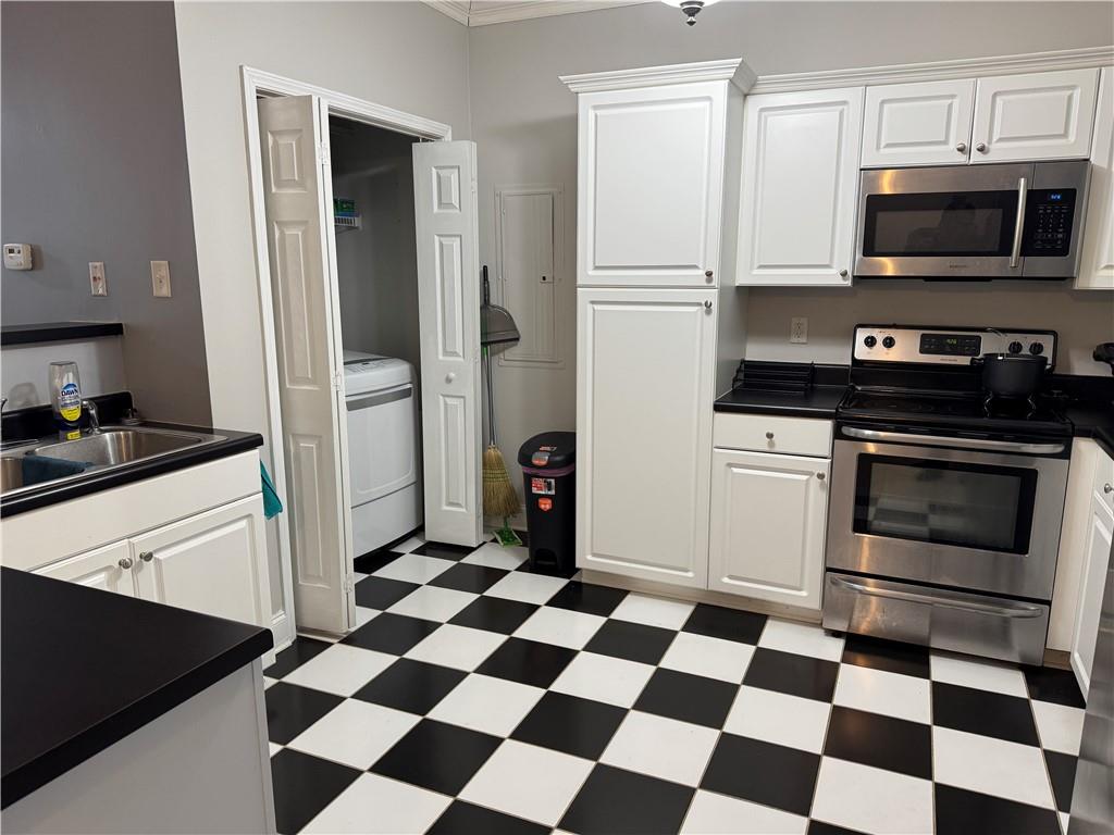24 Intown Place Fayetteville, GA 30214 - Photo 12 of 18 a kitchen with a refrigerator a stove and microwave