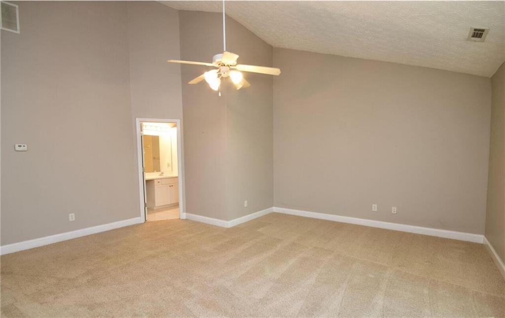 24 Intown Place Fayetteville, GA 30214 - Photo 16 of 18 a view of an empty room with a chandelier fan