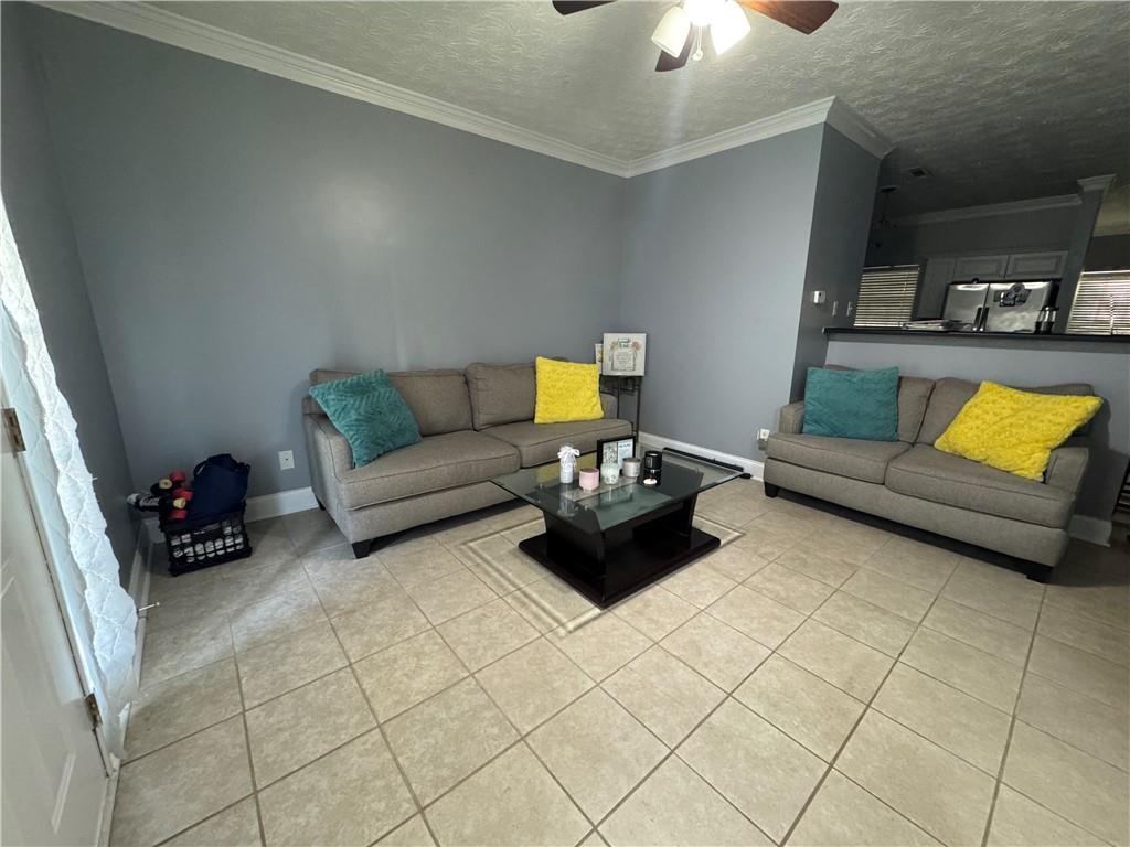 24 Intown Place Fayetteville, GA 30214 - Photo 3 of 18 a living room with furniture and a lamp