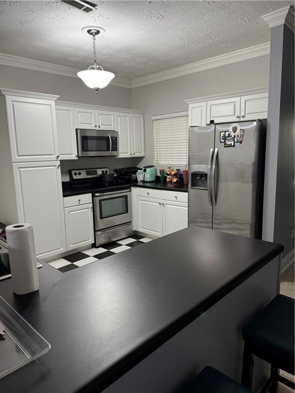 24 Intown Place Fayetteville, GA 30214 - Photo 4 of 18 a kitchen with stainless steel appliances a sink a stove and refrigerator