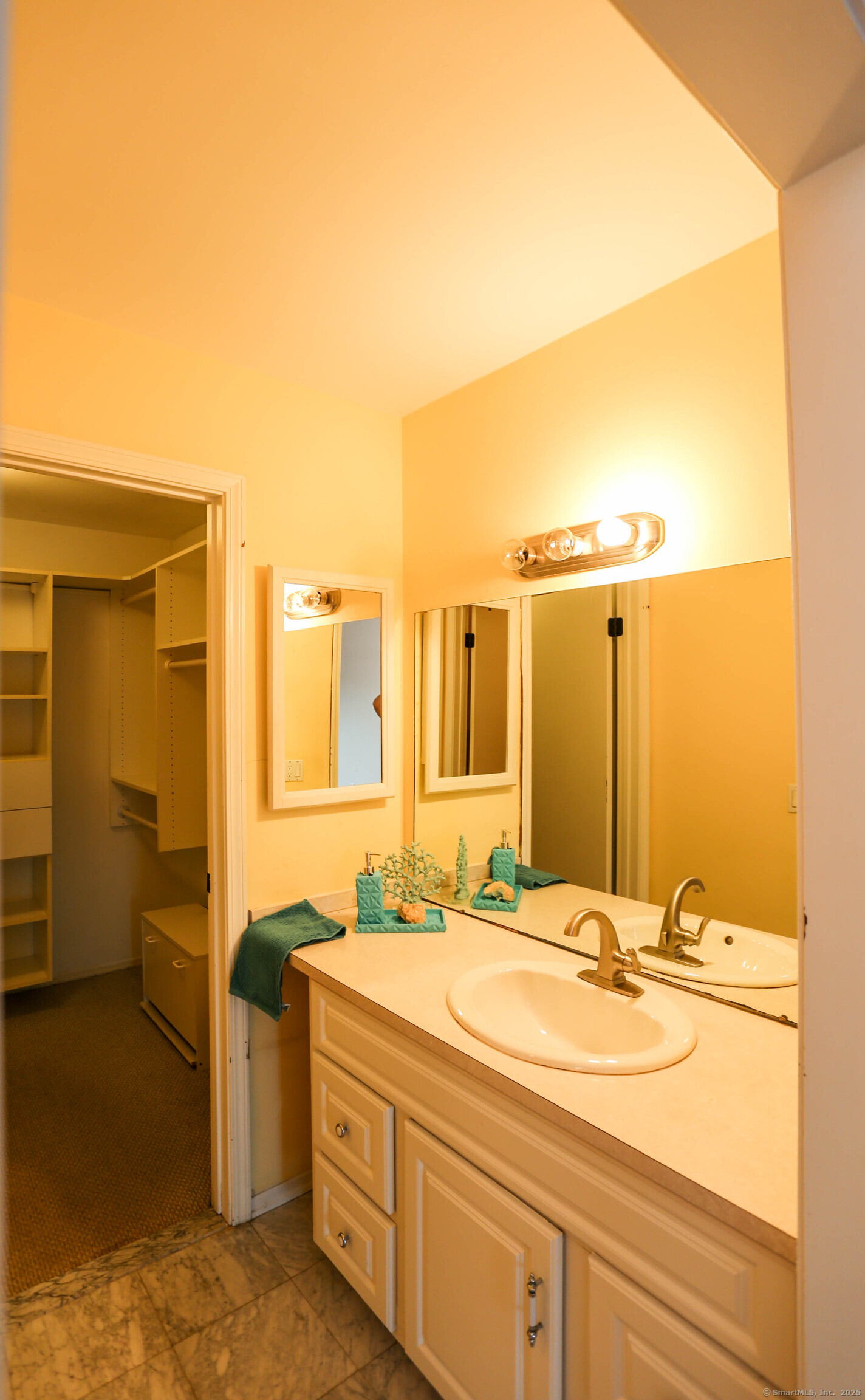 61 Seaview Avenue, Unit 51 Stamford, CT 06902 - Photo 15 of 27 a bathroom with a sink and a mirror