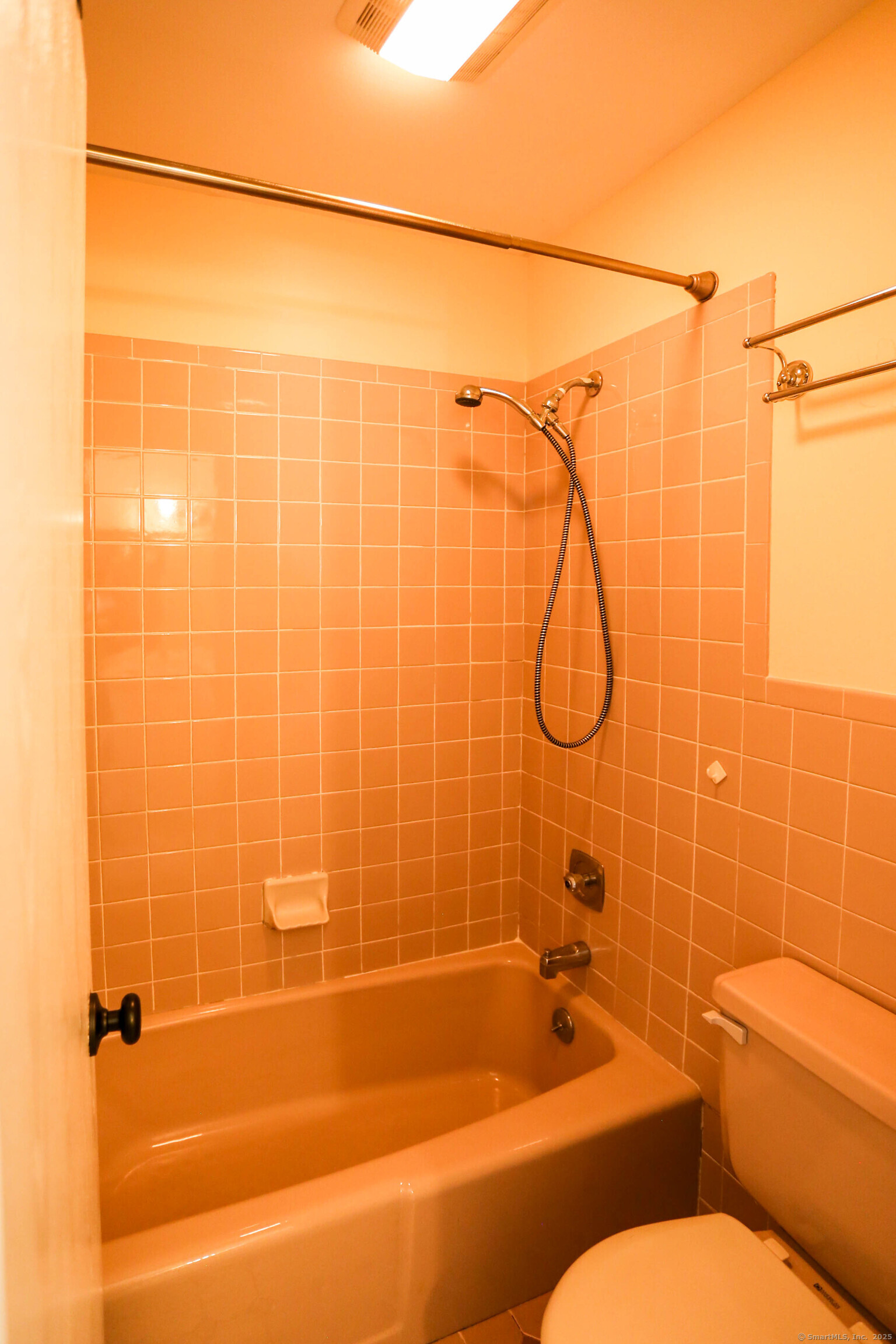 61 Seaview Avenue, Unit 51 Stamford, CT 06902 - Photo 16 of 27 a bathroom with a shower and a toilet sink