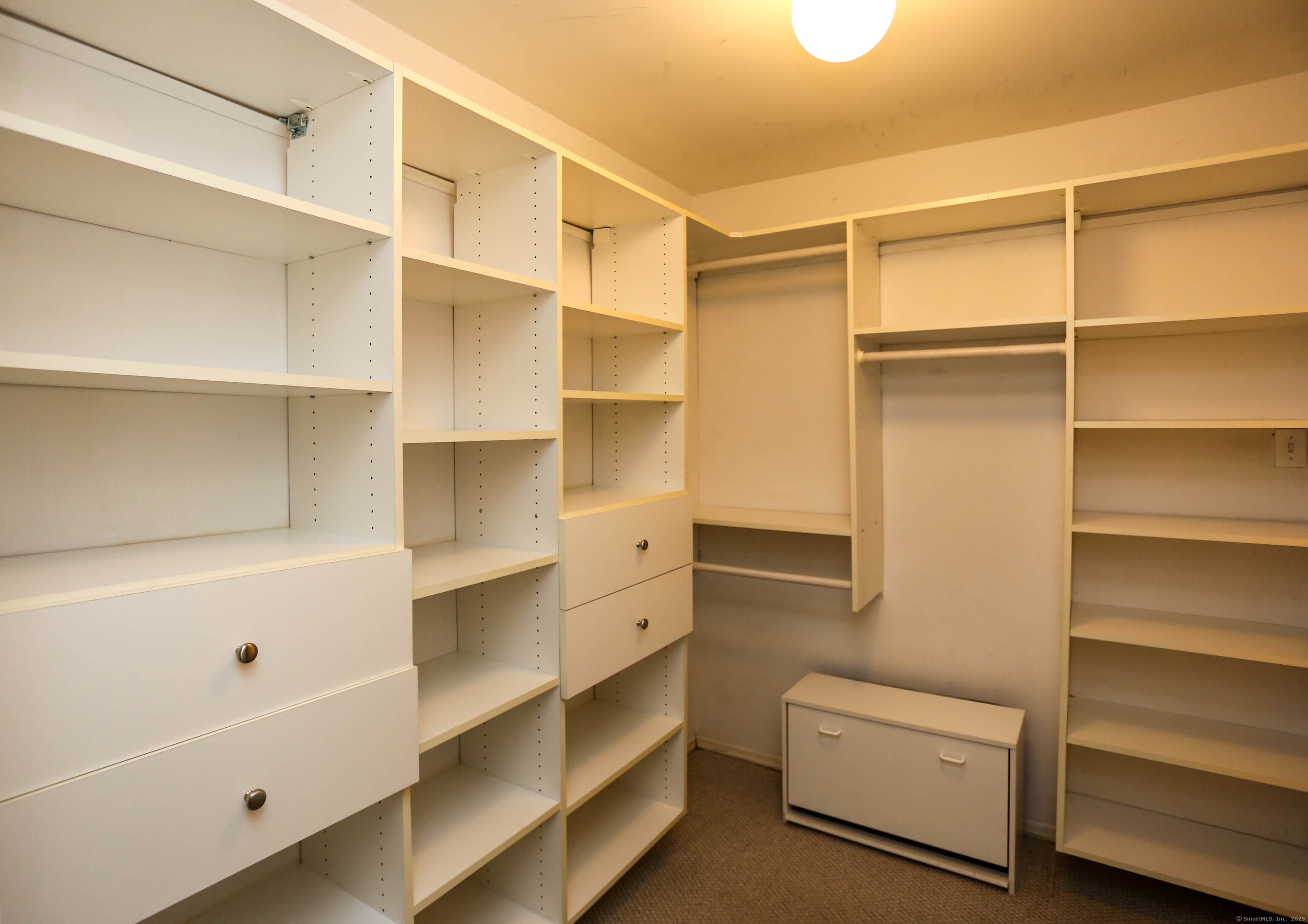 61 Seaview Avenue, Unit 51 Stamford, CT 06902 - Photo 17 of 27 a view of walk in closet with empty racks