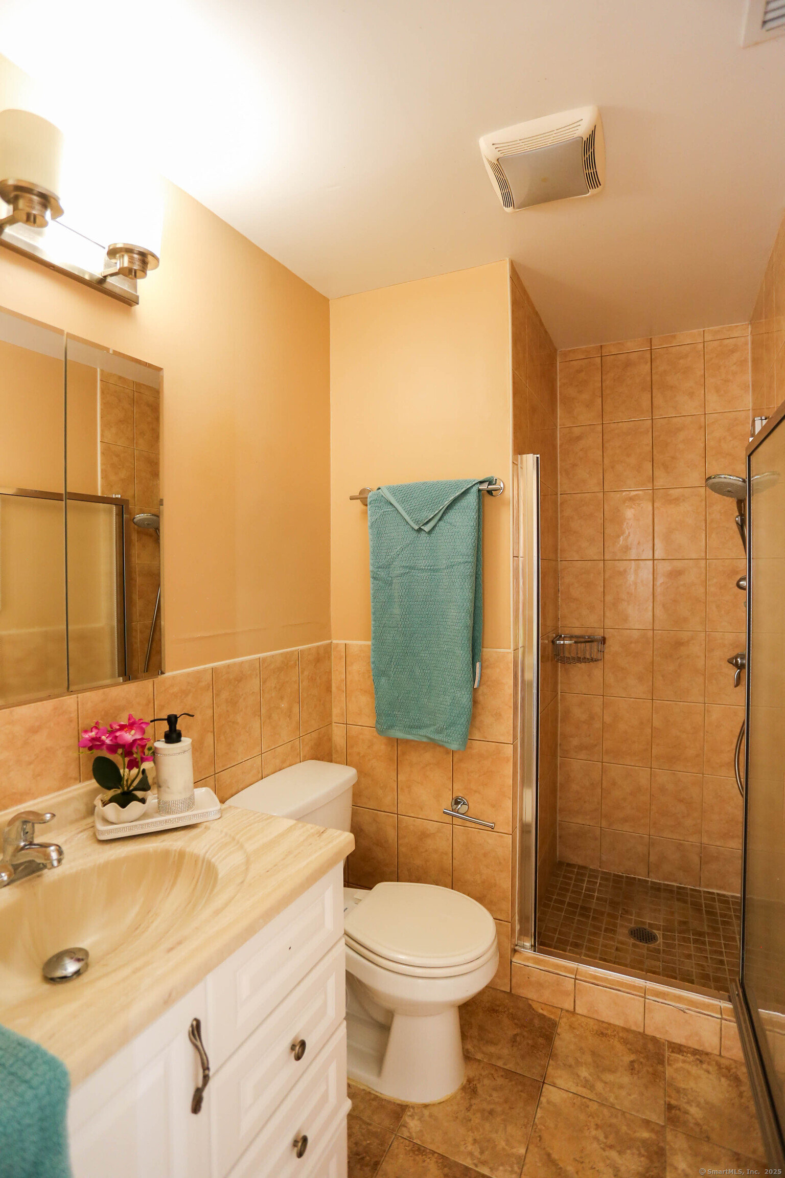 61 Seaview Avenue, Unit 51 Stamford, CT 06902 - Photo 19 of 27 a bathroom with a sink toilet and shower