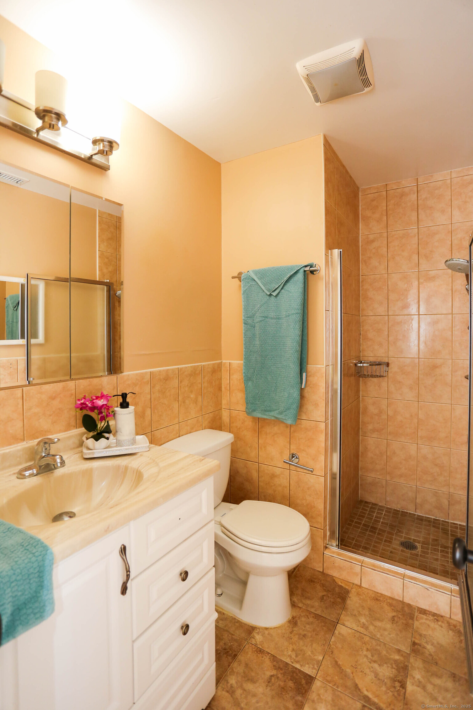 61 Seaview Avenue, Unit 51 Stamford, CT 06902 - Photo 20 of 27 a bathroom with a sink and a mirror