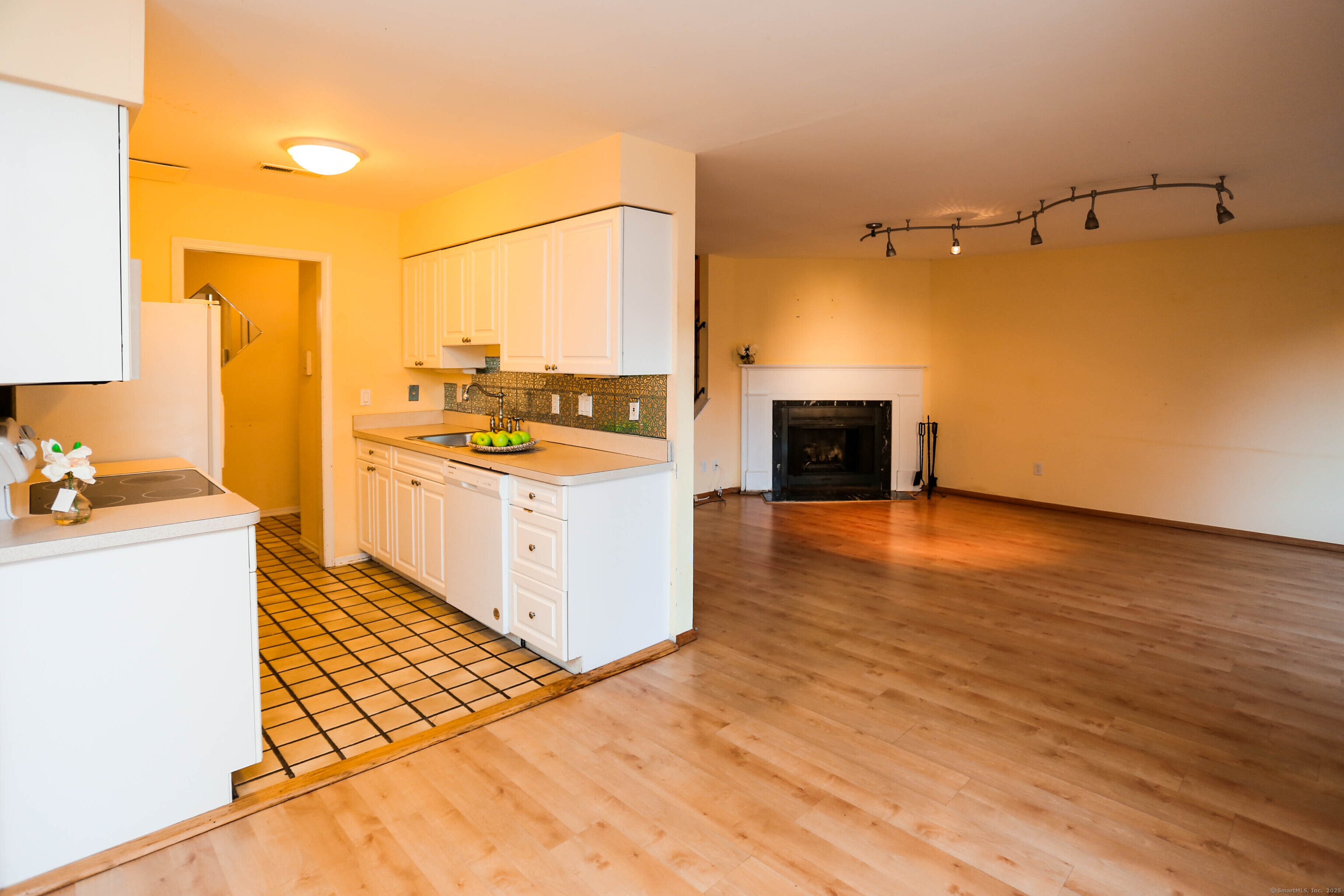 61 Seaview Avenue, Unit 51 Stamford, CT 06902 - Photo 2 of 27 a kitchen with a stove and wooden floor