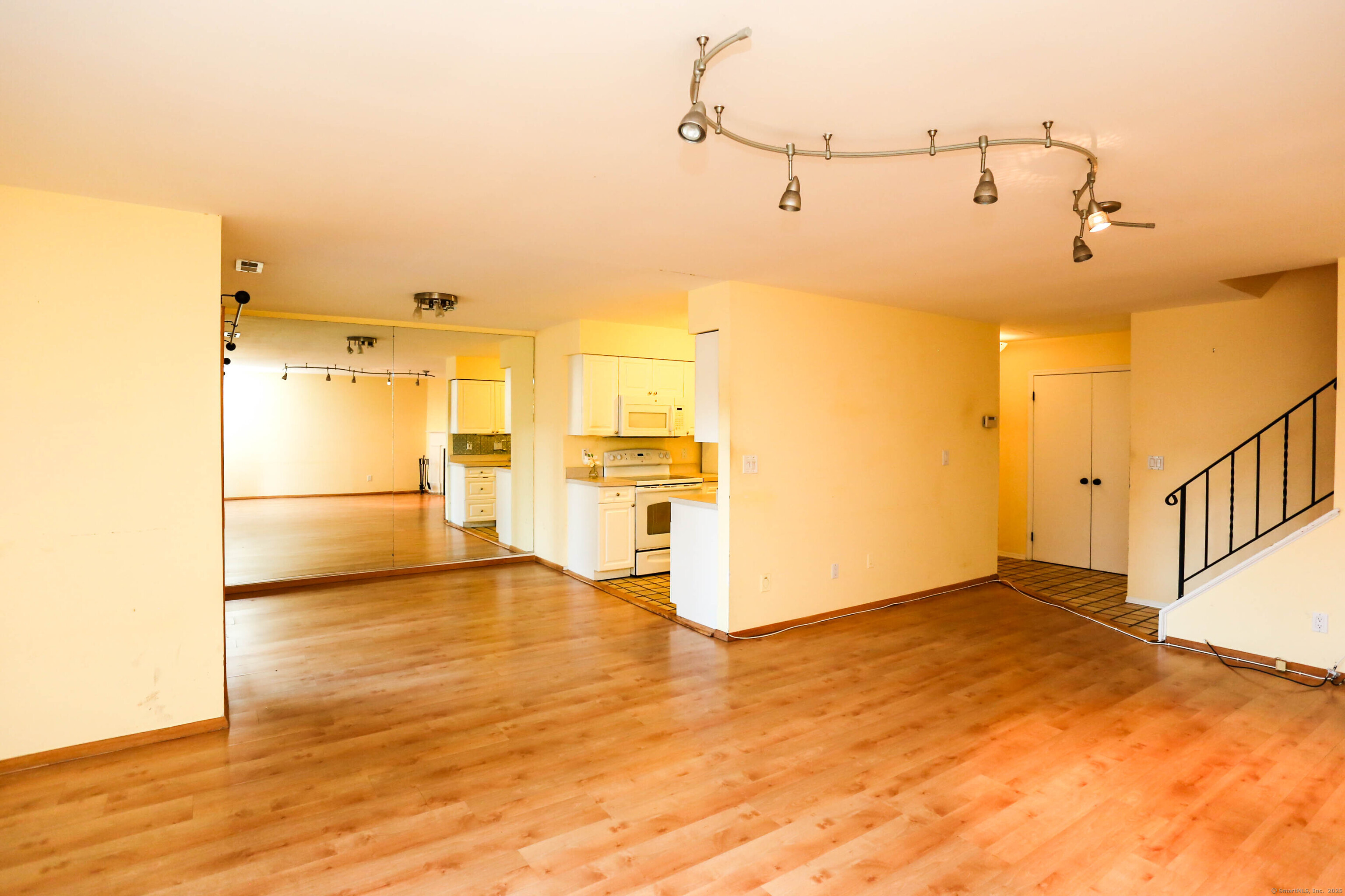 61 Seaview Avenue, Unit 51 Stamford, CT 06902 - Photo 5 of 27 a view of a kitchen with a refrigerator