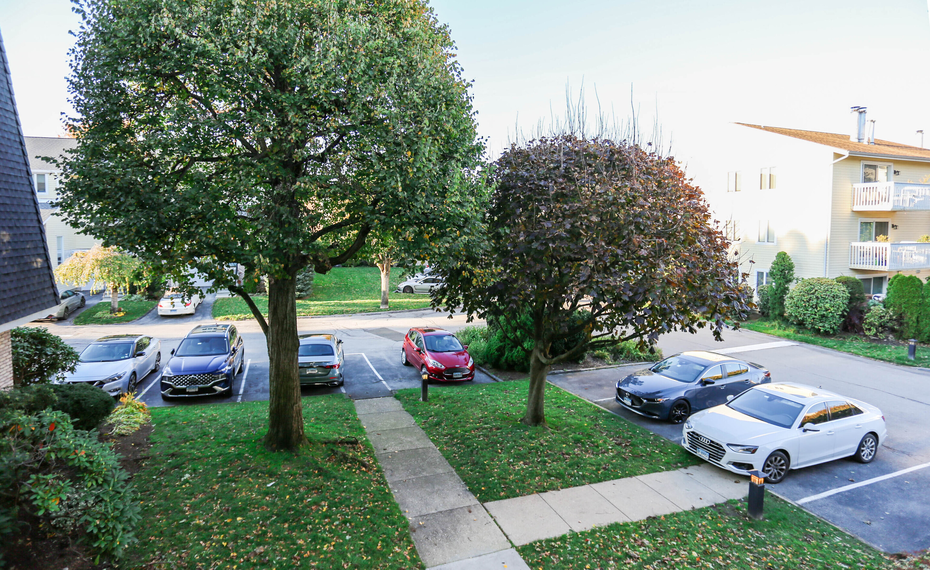61 Seaview Avenue, Unit 51 Stamford, CT 06902 - Photo 6 of 27 a garden view with a sitting space
