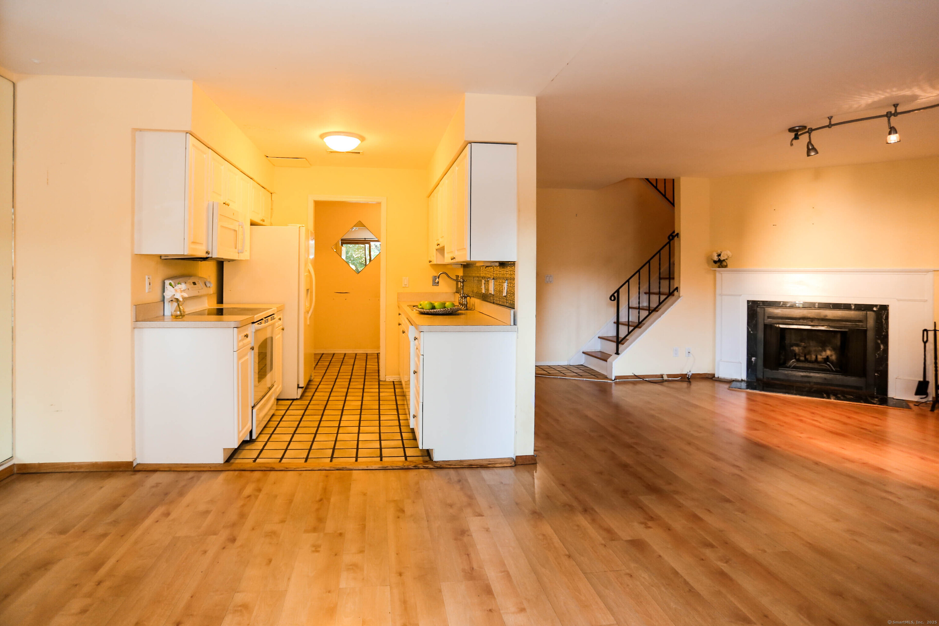 61 Seaview Avenue, Unit 51 Stamford, CT 06902 - Photo 7 of 27 a view of empty room with wooden floor