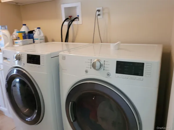 a utility room with dryer and washer