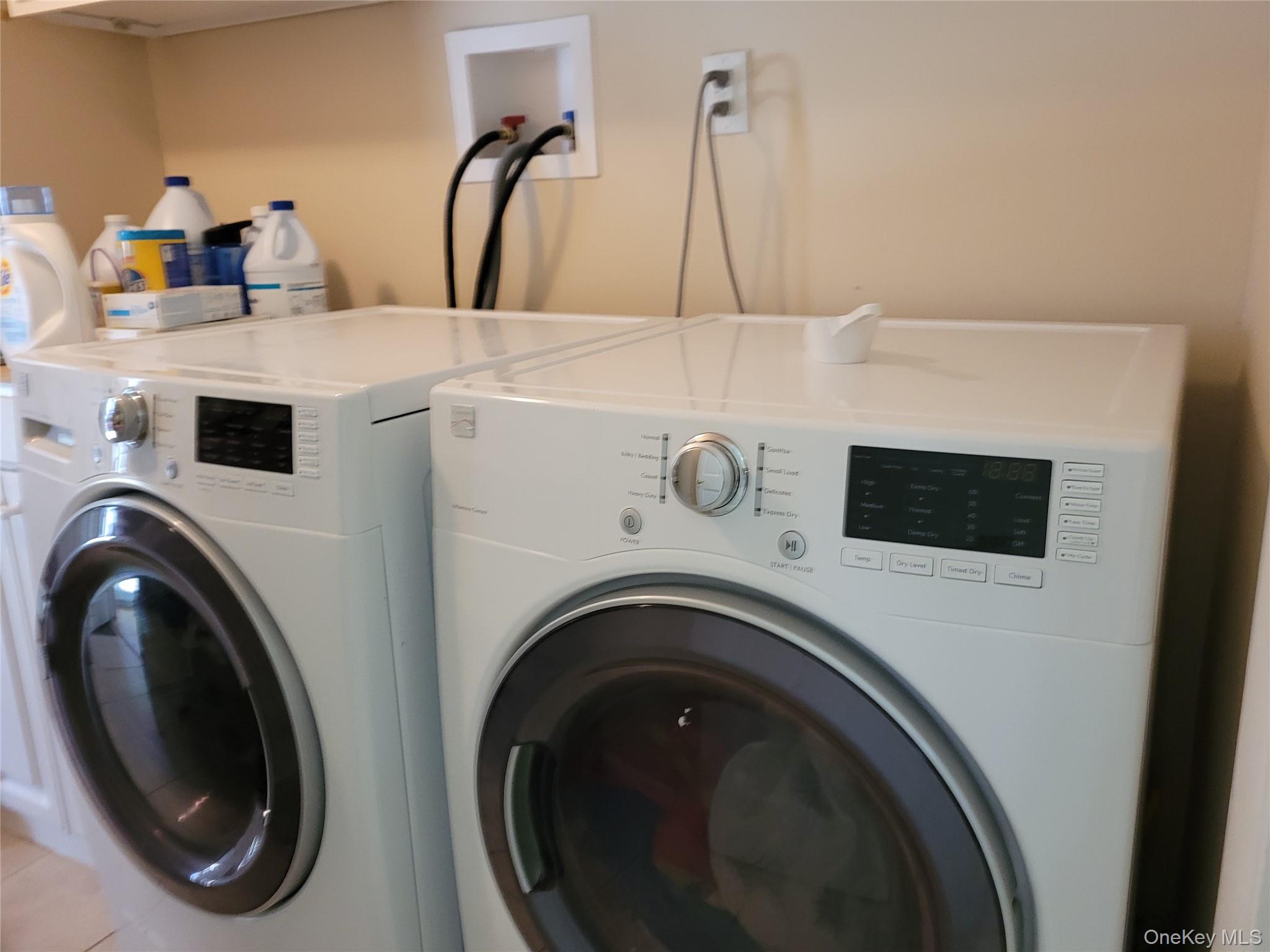 79 Rochester Avenue, Unit GARDEN Long Beach, NY 11561 - Photo 12 of 15 a utility room with dryer and washer