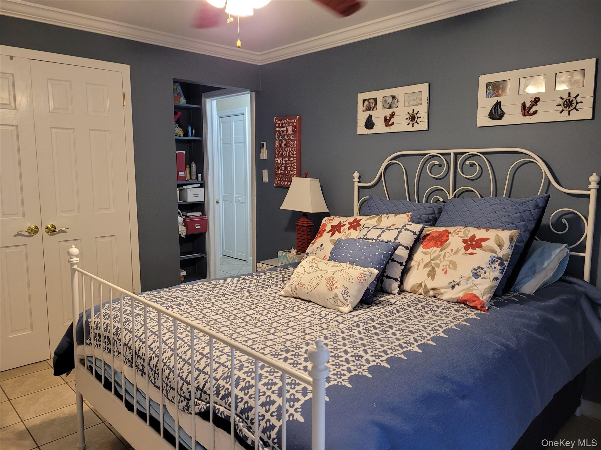 79 Rochester Avenue, Unit GARDEN Long Beach, NY 11561 - Photo 8 of 15 a bedroom with a large bed and a window