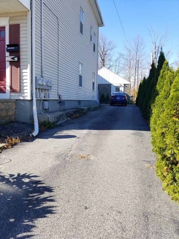 55 Granite Street Webster, MA 01570 - Photo 3 of 5 a view of a house with a yard