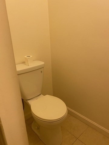 45 Webster Street, Unit 2 Woburn, MA 01801 - Photo 8 of 10 a white toilet sitting next to a white wall