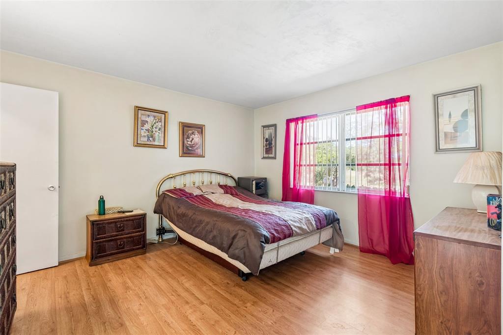 2059 Waterfall Drive Spring Hill, FL 34608 - Photo 17 of 26 a bedroom with a bed and a window