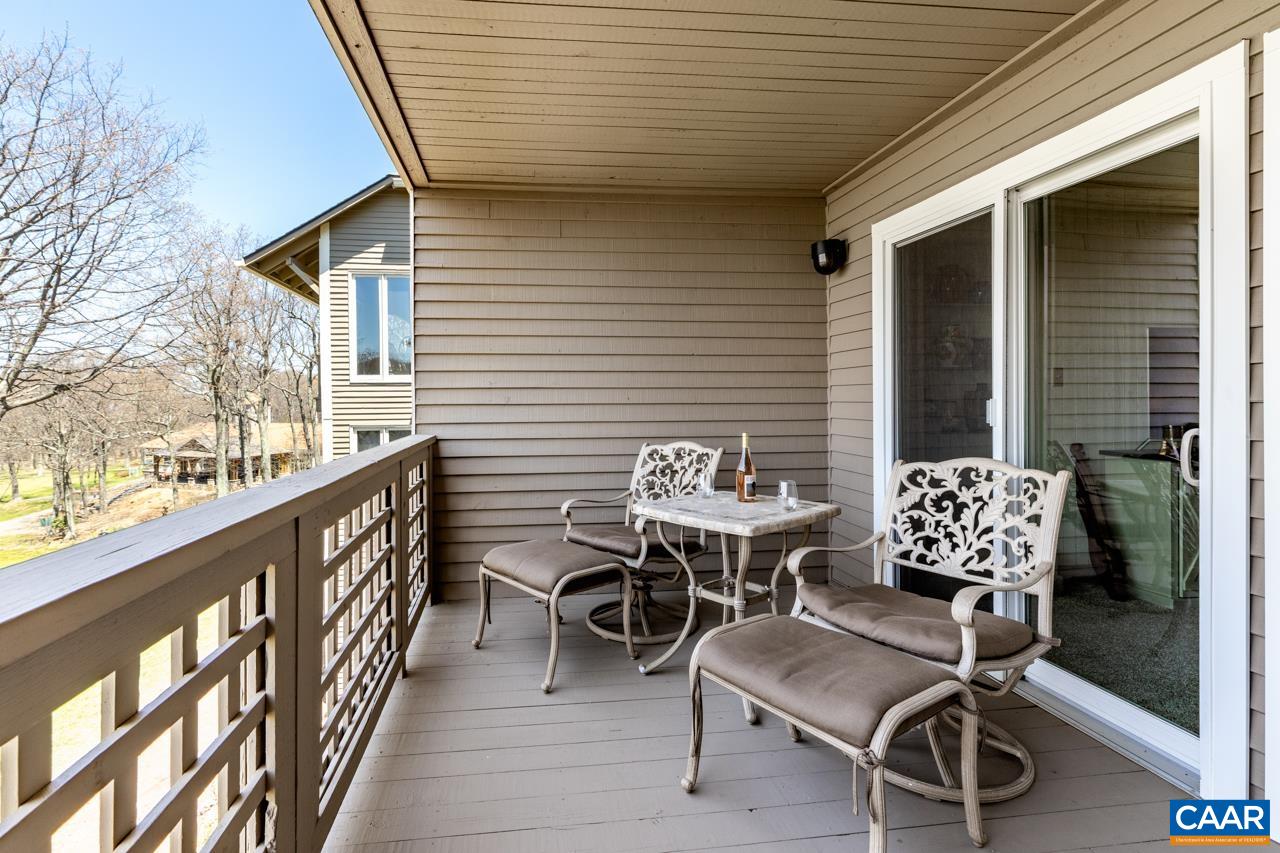 2053 Stone Ridge Roseland, VA 22967 - Photo 2 of 22 a balcony with furniture and wooden floor