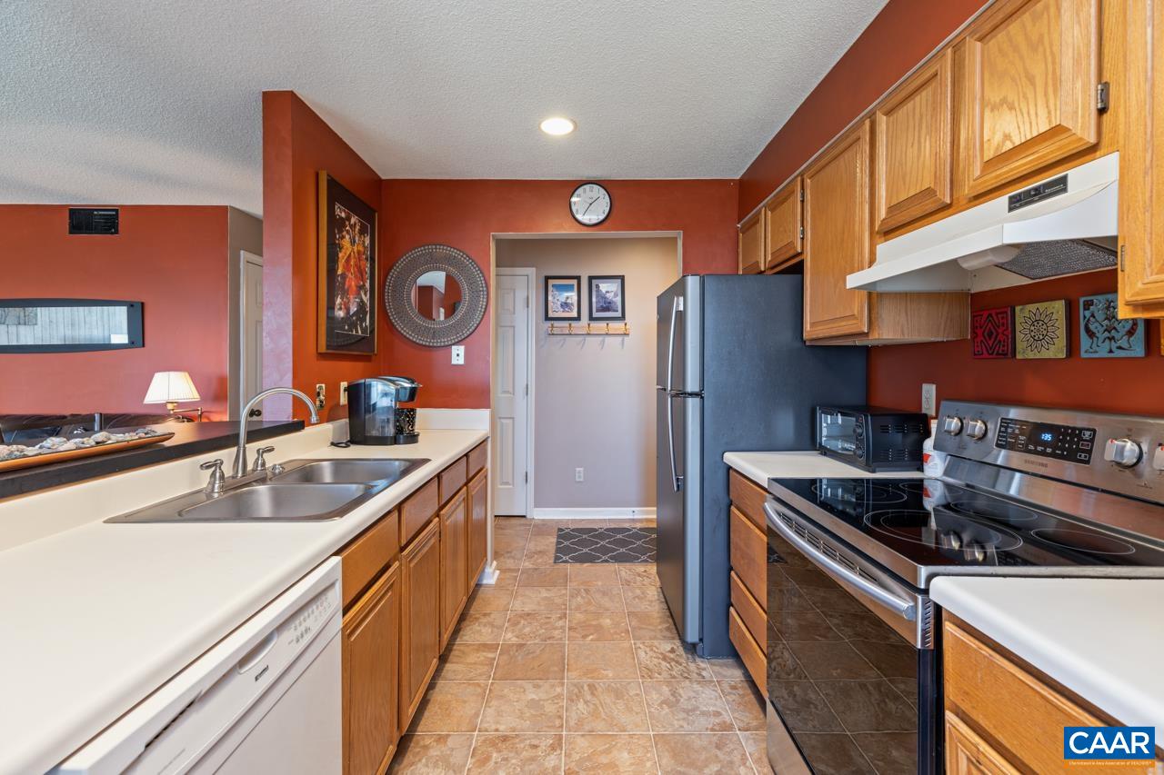 2053 Stone Ridge Roseland, VA 22967 - Photo 3 of 22 a kitchen with stainless steel appliances granite countertop a sink stove and refrigerator