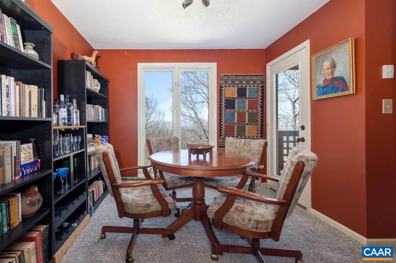2053 Stone Ridge Roseland, VA 22967 - Photo 7 of 22 a view of a dining room with furniture and a book shelf
