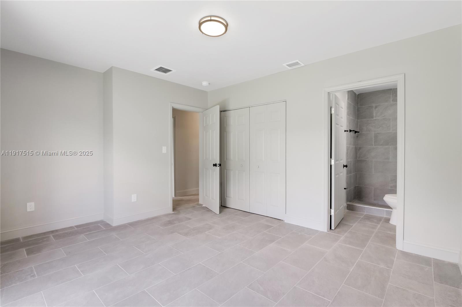 981 Northwest 4th Avenue, Unit 1 Pompano Beach, FL 33060 - Photo 11 of 12 a view of an empty room